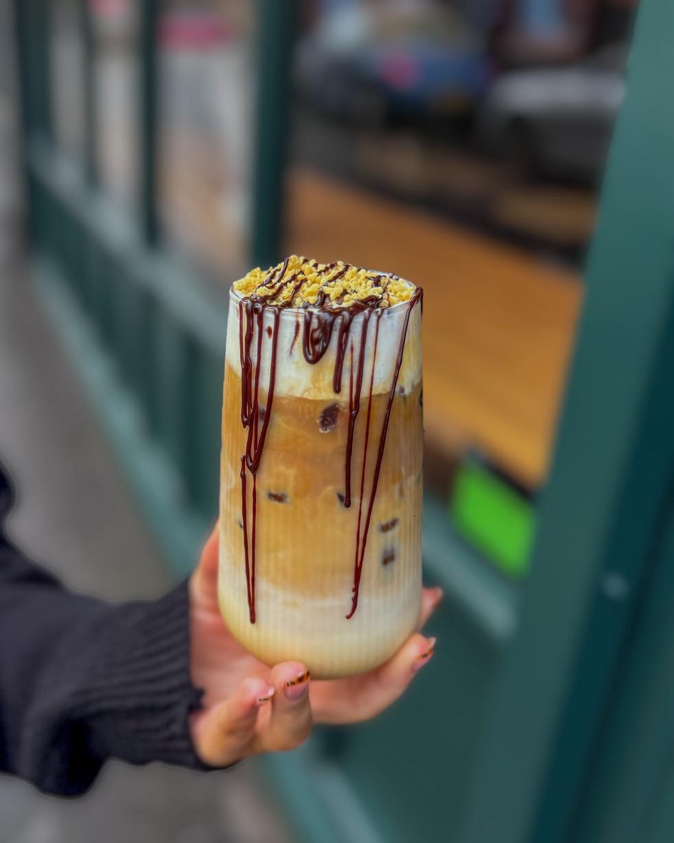 Iced latte with chocolate drizzle at City Sips