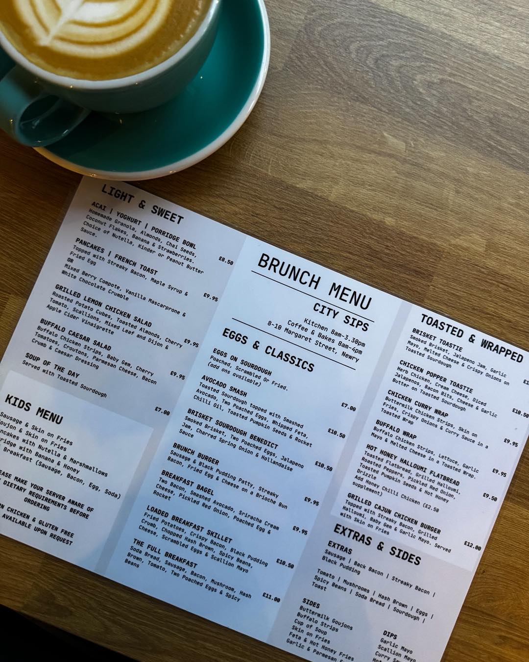 City Sips brunch menu and coffee on a table